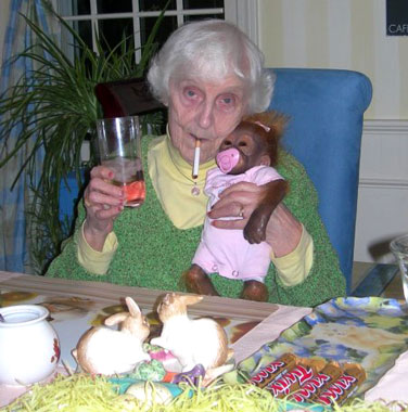 Woman smoking with pet monkey