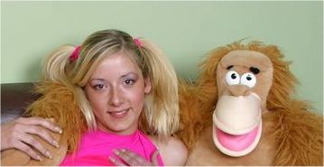 plushie monkey chimp poses with teenage girl hair ribbons