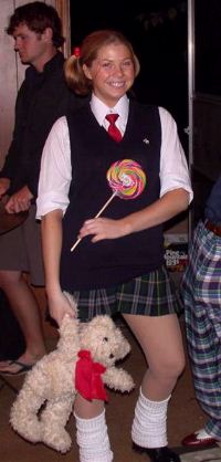 teen party girl with school uniform, giant lollipop, loose socks and teddy bear