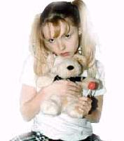 Cute teen girl Trisha with her teddy bear and lollipop